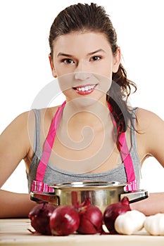 Young woman cooking healthy food