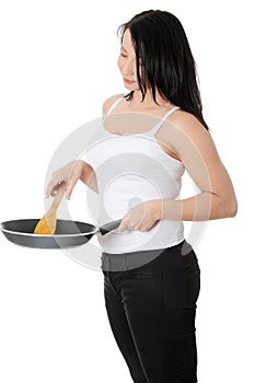 Young woman cooking healthy food