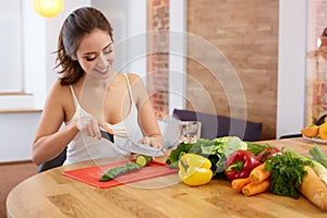 Young Woman Cooking. Healthy Food - Vegetable Salad. Diet. Healt