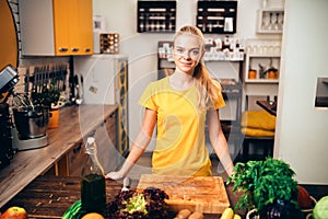 Young woman cooking on the kitchen, healthy food