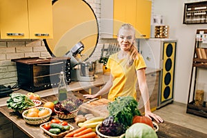 Young woman cooking on the kitchen, healthy food