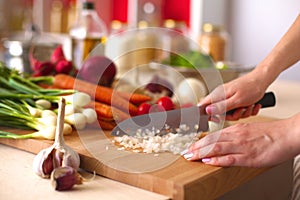 Young Woman Cooking in the kitchen. Healthy Food