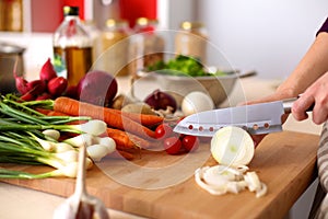 Young Woman Cooking in the kitchen. Healthy Food