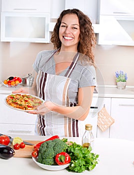 Young Woman Cooking Pizza