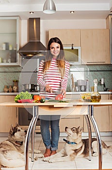 Young Woman Cooking Vegetable Salad