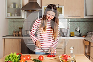 Young Woman Cooking Vegetable Salad