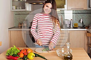 Young Woman Cooking Vegetable Salad