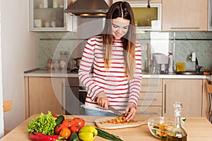 Young Woman Cooking Vegetable Salad