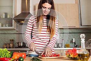 Young Woman Cooking Vegetable Salad