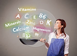 Young woman cooking vitamins and minerals