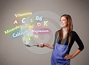 Young woman cooking vitamins and minerals