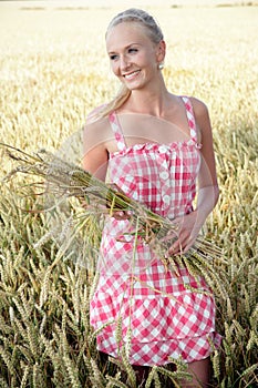 Young woman in a corn field