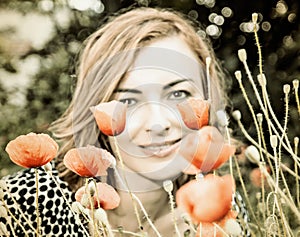 Young woman with corn poppy flowers, vintage filter