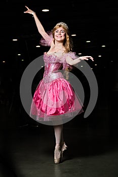 Young woman cosplayer wearing pink dress