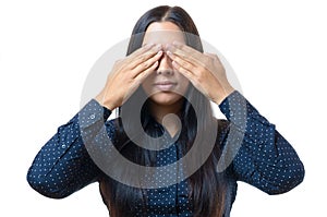 Young woman covering her eyes with her hands