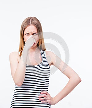 Young woman covering her nose with hand