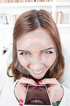 Young woman with crazy face expression
