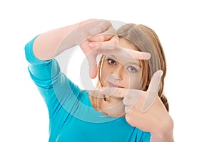 Young woman creating frame with fingers