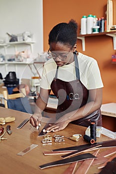 Young Woman Creating Handmade Belt