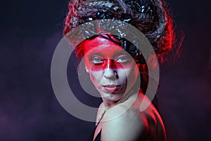 Young woman with creative face-art