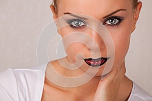 young woman with creative lips make-up