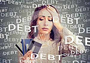 Young woman with credit card debt photo