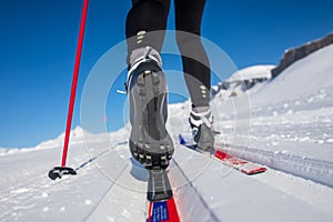 young woman cross-country skiing on a winter day