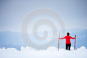 Young woman cross-country skiing on a  winter day