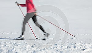 Young woman cross-country skiing on a winter day