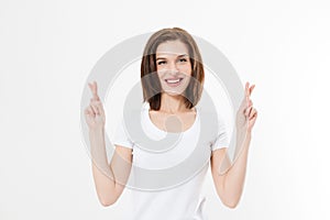 Young woman cross fingers for wishing good luck isolated on white background.Template summer t shirt. Copy space