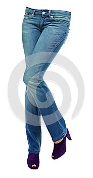 Young woman crossed legs with clear blue jeans and purple peep t photo