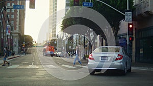 Young woman crossing street following traffic rules. Asian girl walking road