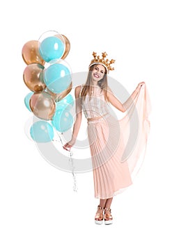 Young woman with crown and air balloons