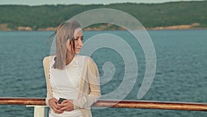 Young woman on cruise ship at sunrise