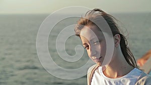 Young woman on cruise ship at sunrise