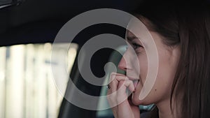 young woman is crying inside car after accident, afraid female driver, closeup portrait