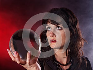 Young woman with crystal ball.