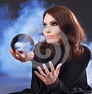 Young woman with crystal ball.