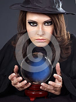 Young woman with crystal ball.