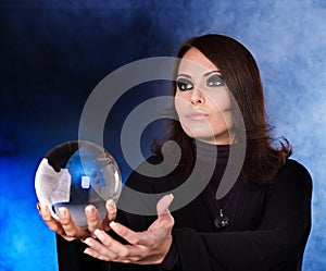 Young woman with crystal ball.