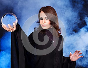 Young woman with crystal ball.