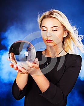 Young woman with crystal ball.