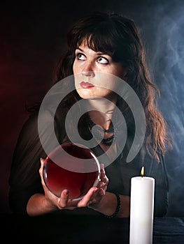 Young woman with crystal ball.