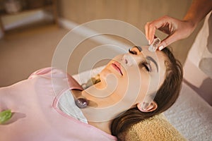 Young woman at crystal healing session