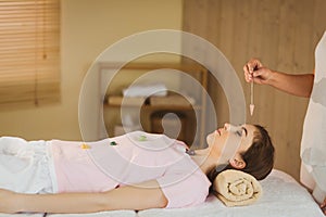 Young woman at crystal healing session