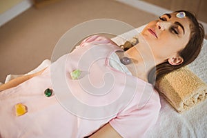 Young woman at crystal healing session