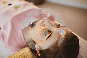 Young woman at crystal healing session