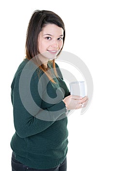 Young woman with cup of coffee looks camera
