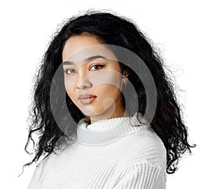 Young woman with curly black hair.