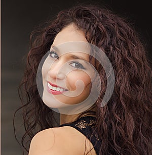 Young woman with curly dark hair